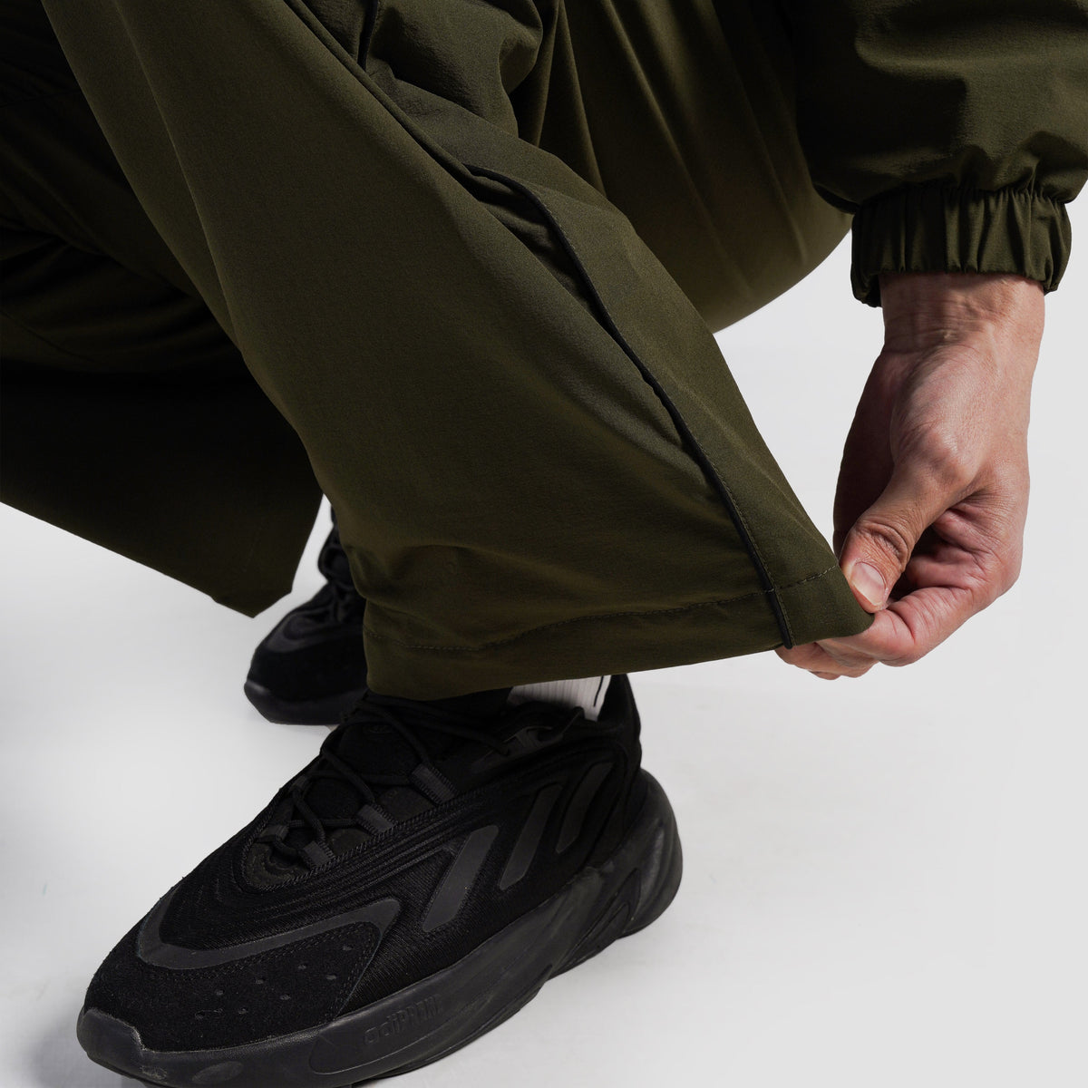 Fabric texture close-up of Olive Maxout Track Pants for men