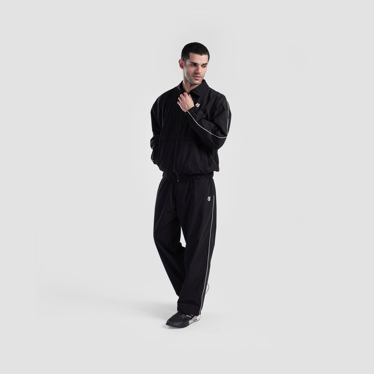 Full-length view of Black Maxout Track Pants for men
