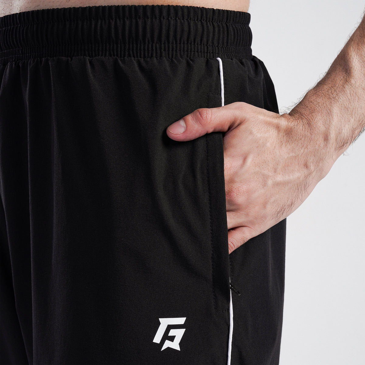Close-up stitching detail on Black Maxout Track Pants for men