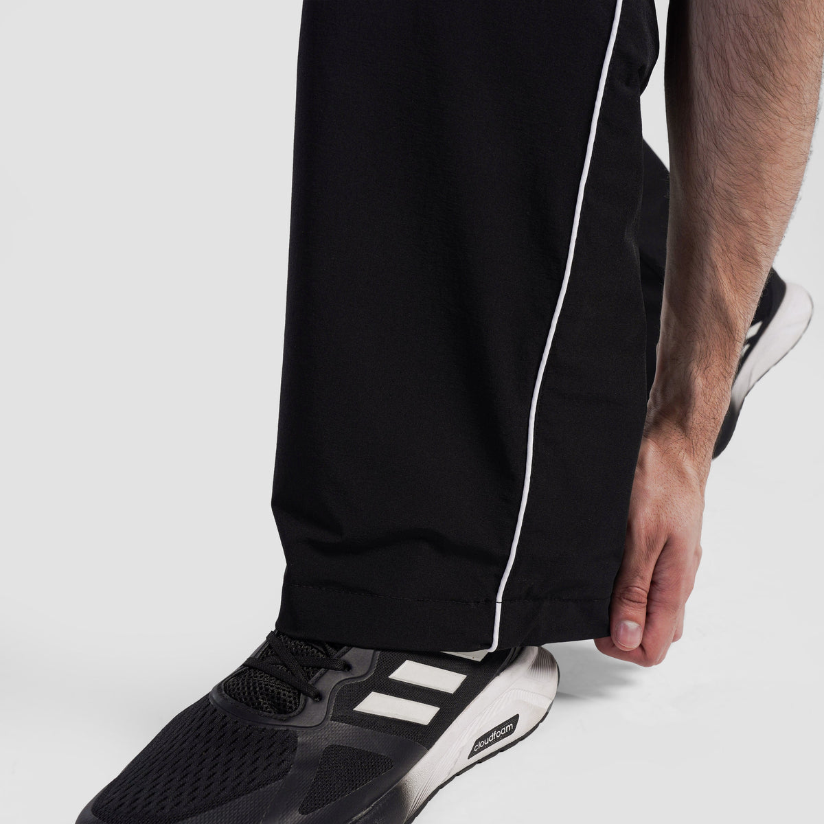 Fabric texture close-up of Black Maxout Track Pants for men