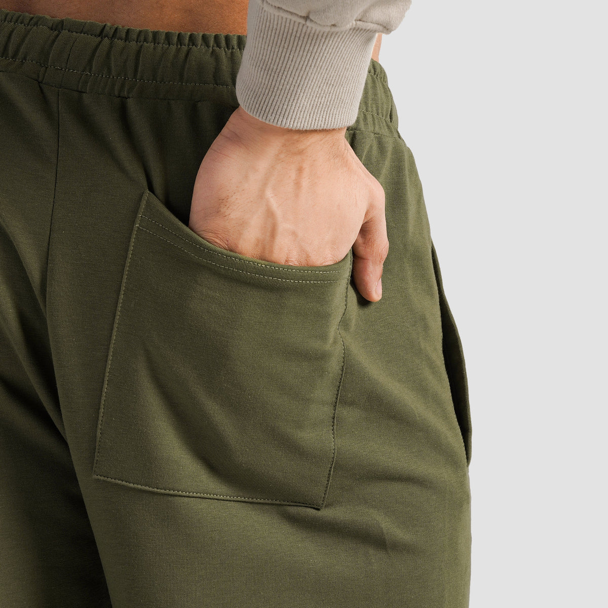 Close-up stitching detail on Olive Spectraflex Trousers for men