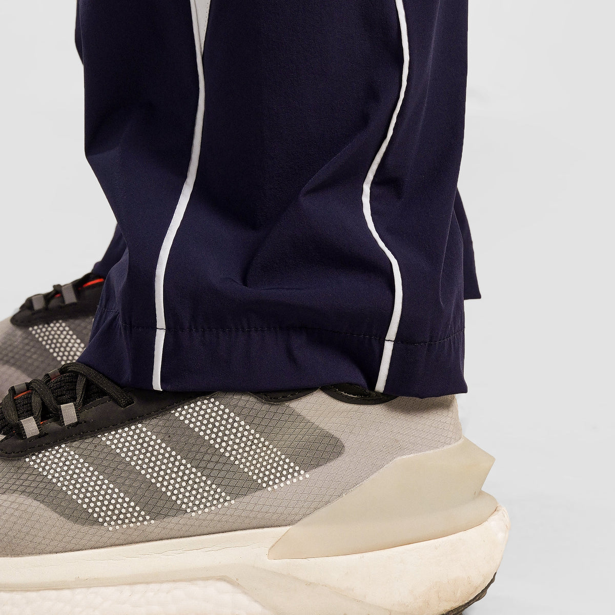 Close-up stitching detail on Navy Dual Stripe Trousers 2.0 for men