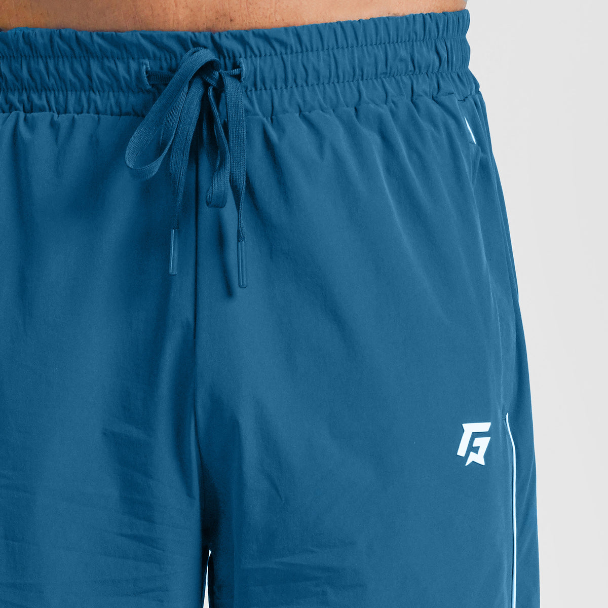 Close-up stitching detail on Aqua Blue Erecto Stride Trousers for men
