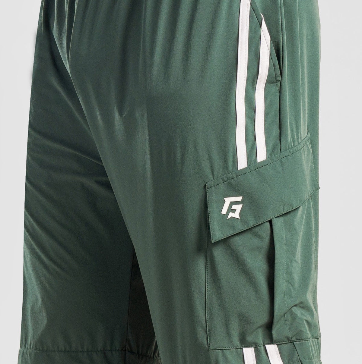 Close-up stitching detail on Green Stride Stripe Trousers for men