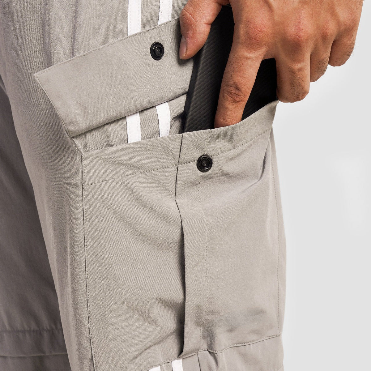 Close-up stitching detail on Light Grey Stride Stripe Trousers for men