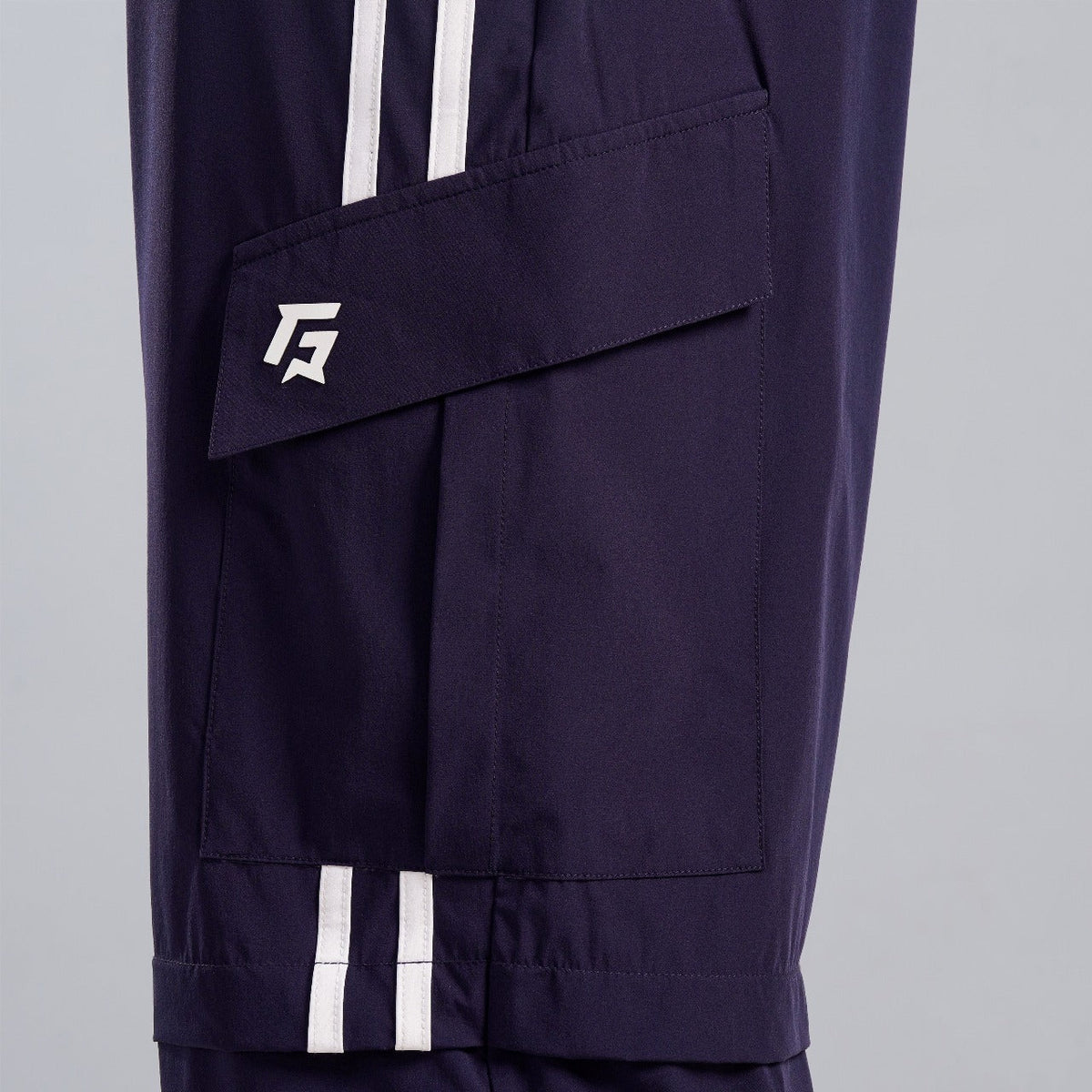 Close-up stitching detail on Navy Stride Stripe Trousers for men