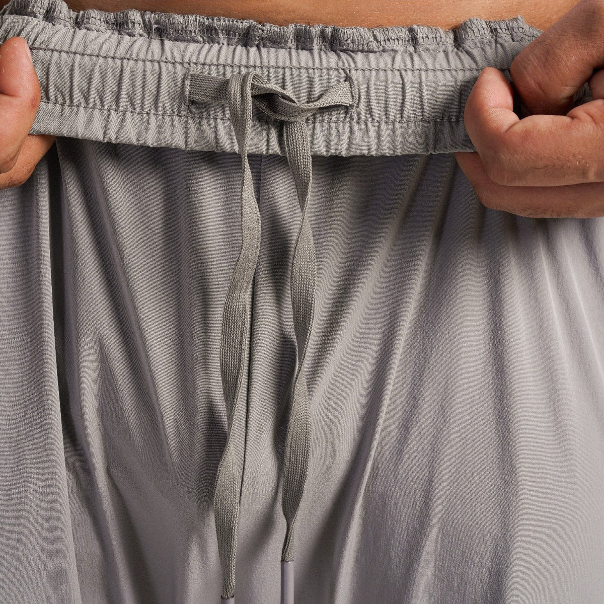 Fabric texture close-up of Light Grey Stride Stripe Trousers for men