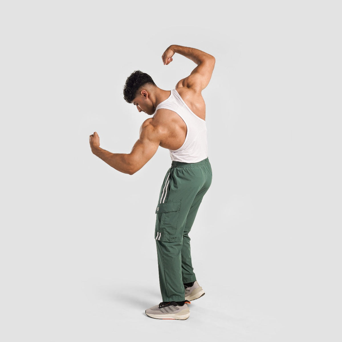 Full-length view of Green Stride Stripe Trousers for men